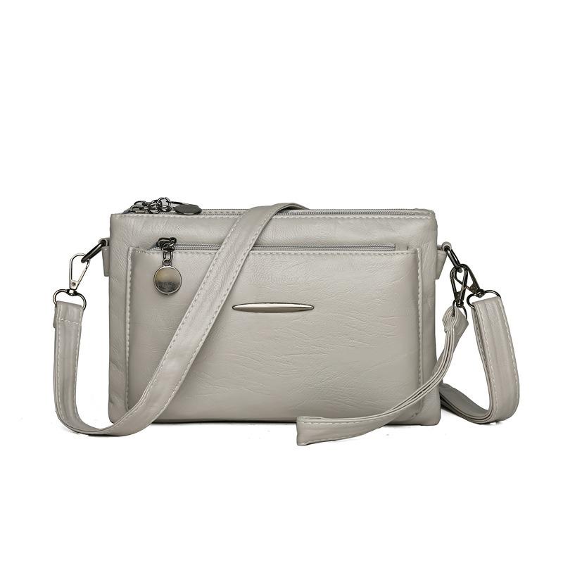 Umhängetasche mit einem Schultergurt für Mobiltelefon und Kleingeld