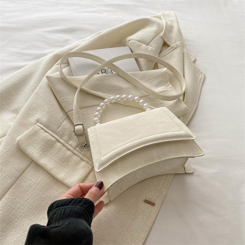 Fashion 2025 Summer New Fashion Design One Shoulder Crossbody Foreign Style Solid Color Retro Fresh Pearl Portable Crossbody