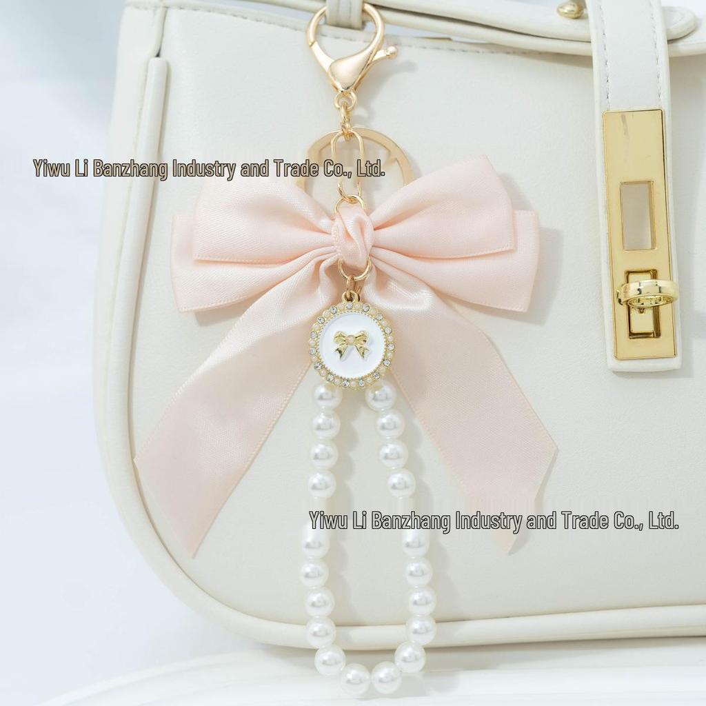 Large Bow Faux Pearl Bracelet Keychain with Colored Woven Strap and Alloy Tag Pendant