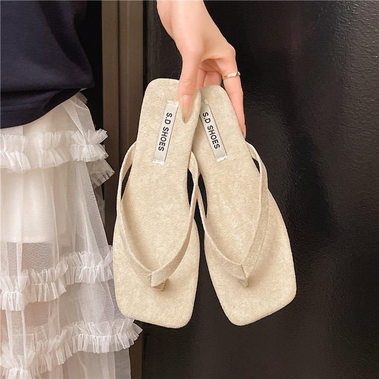 

Korean version of simple flat-bottomed open-toed slippers female summer wear niche woven skirt fairy beach cool slippers 41