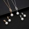 Simple faux pearl pendant necklace and earrings inlaid with rhinestones, creative spiral-shaped bridal accessories to match wedding dresses, suitable
