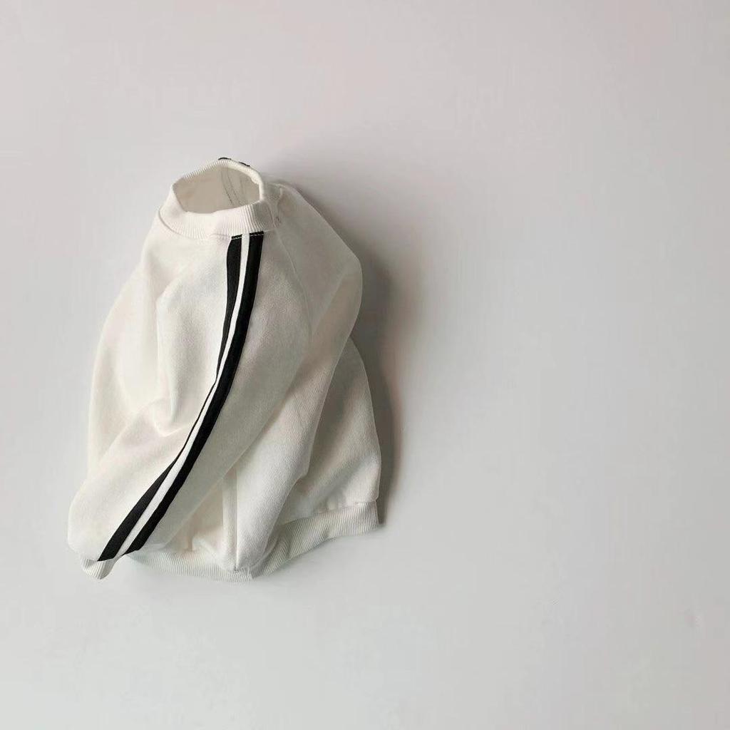 Korean-Style Unisex Baby Sweatshirt and Pants Set - Solid Color with Webbing Stripe Patchwork for Autumn and Spring.