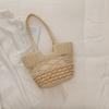 Handwoven Natural Fiber Tote Bag with Braided Handles and Open Weave Design