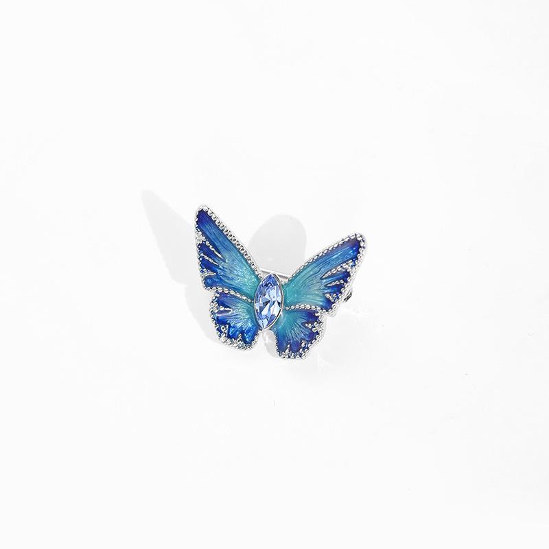 Simple and fashionable oil drop butterfly brooch Female Korean temperament pin jacket Xiaoxiangfeng crystal corsage