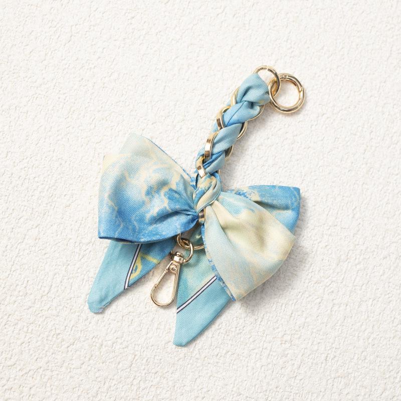 Elegant Hand-Woven Scarf Chain with Bow Decoration Pendant for Bag Strap Modification.