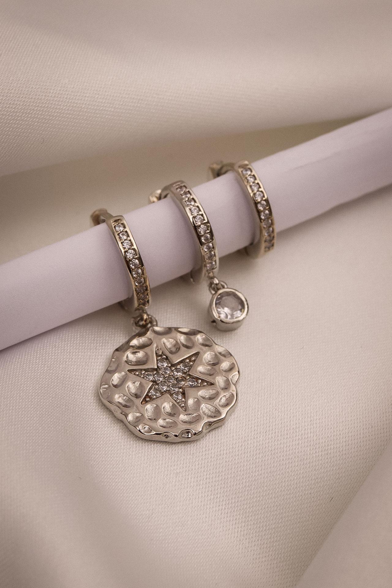 

Серьги серебряного цвета из трех частей с цирконом и звездами