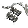 Skin-brightening grey press-on nails featuring detachable black Chrome Hearts-style crosses; entirely handmade.