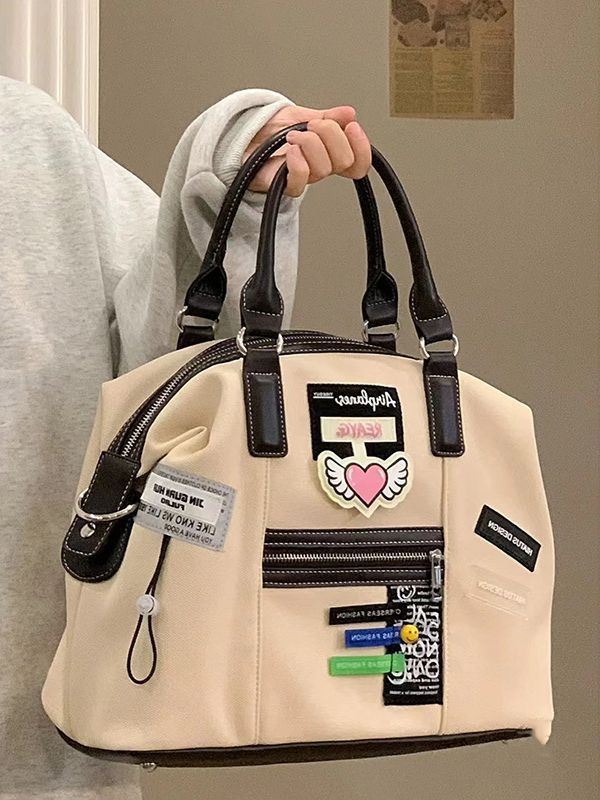 

Customized women s 2025 new retro creative label bag casual commuter canvas messenger bag tote schoolbag travel bag слонова кістка