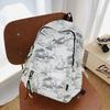Cartable haute valeur style national sac à dos à encre simple et tendance style campus sac à dos étudiant grande capacité léger sac à dos réduisant la charge