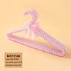 Pearl Hanger: Chic Clothing Display for Fashionable Stores