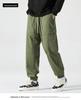Men's American-Style Autumn Overalls: Fashionable, Casual, Versatile Nine-Point Pants with Loose Cuffs and Multi-Pocket Design.