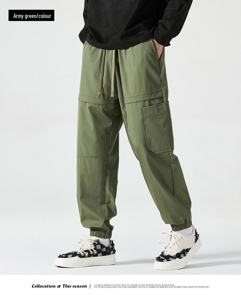 Men's American-Style Autumn Overalls: Fashionable, Casual, Versatile Nine-Point Pants with Loose Cuffs and Multi-Pocket Design.