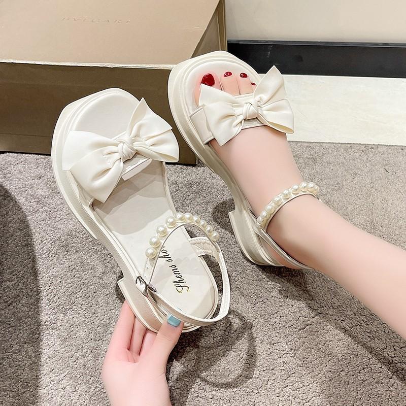 Plateausandalen Feenstil mit Rock 2025 Sommer neu Schleife Damenschuhe Perle Mode vielseitig Strandschuhe