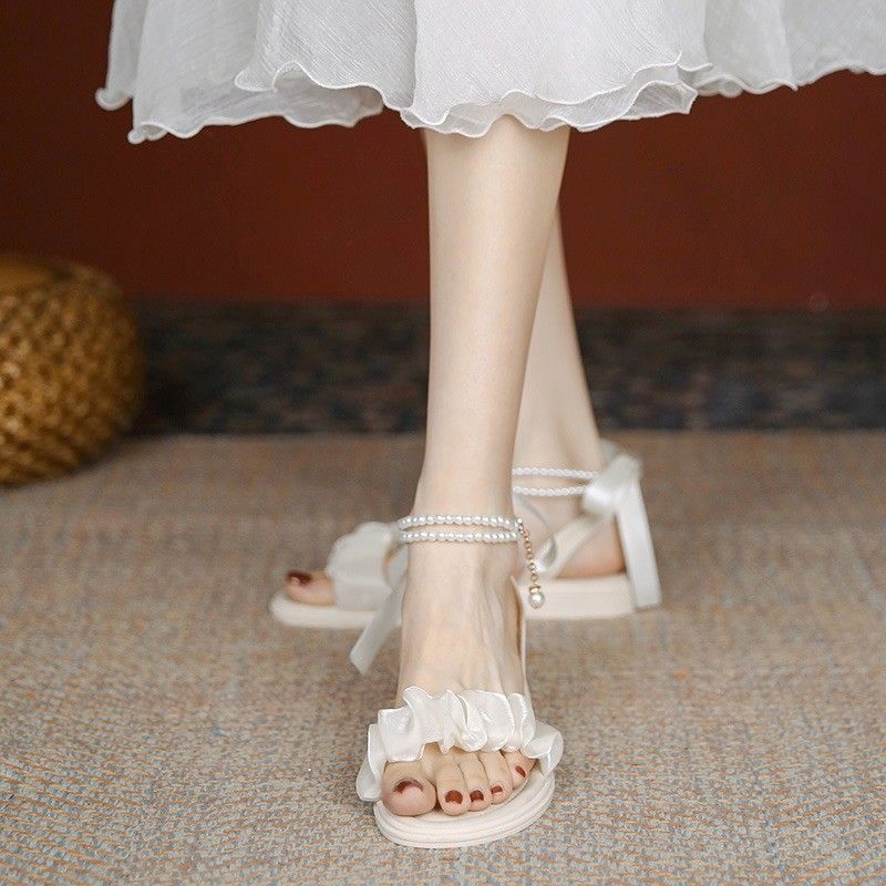 Fairy style with skirt medium heel Roman sandals women's 2025 summer new bow pearl versatile thick heel shoes