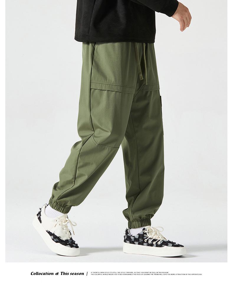 Men's American-Style Autumn Overalls: Fashionable, Casual, Versatile Nine-Point Pants with Loose Cuffs and Multi-Pocket Design.