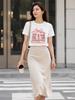 A stylish and versatile white T-shirt with pink book and bow-themed details, perfect for a sophisticated summer look.