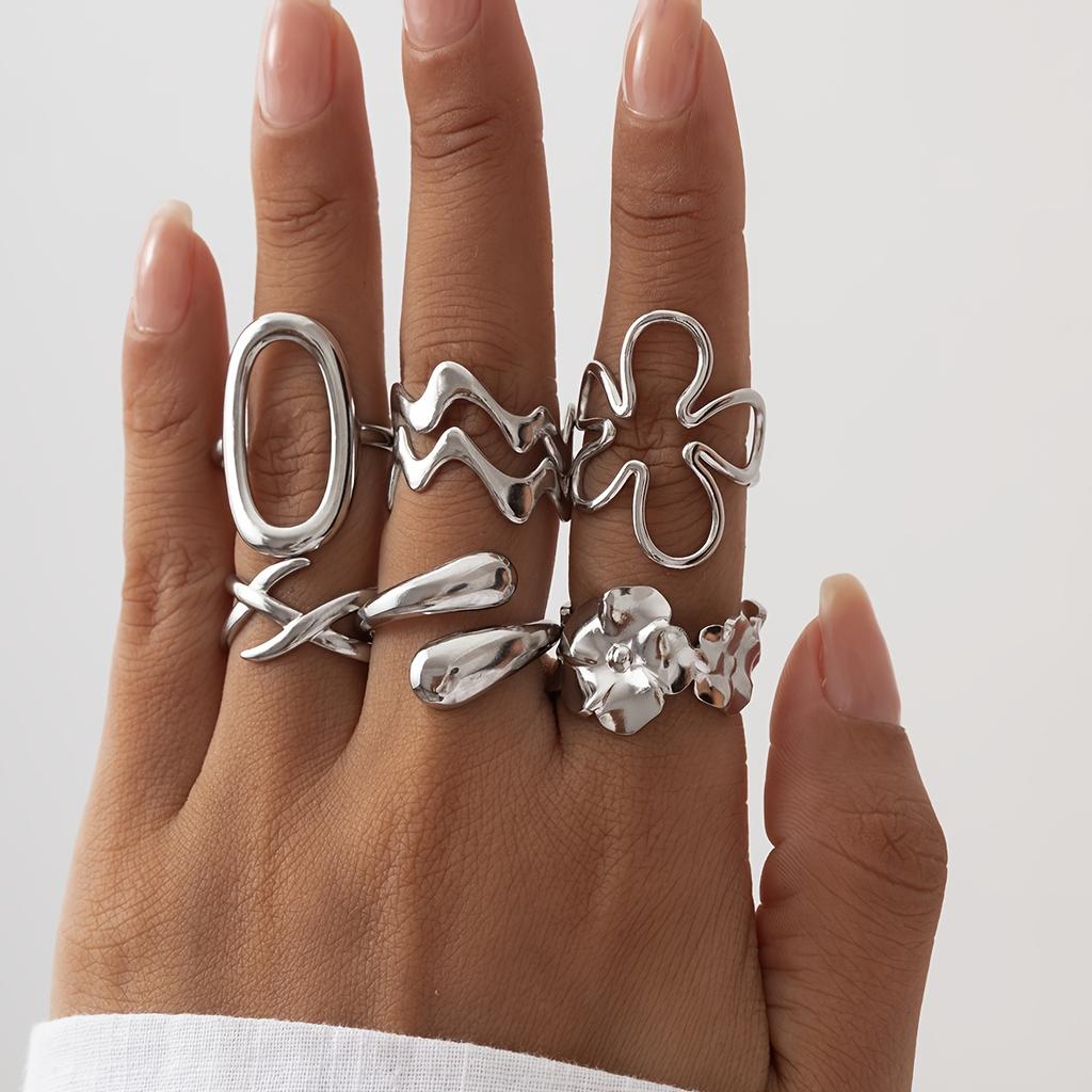 Fashionable stainless steel ring with a simple hollow geometric design, suitable for stacking and versatile for casual wear