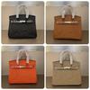 2026 New TOGO Leather Pressed Convex Mark Carriage Platinum Bag Genuine Leather Women's Bag First Layer Cowhide European and American Hand Bag