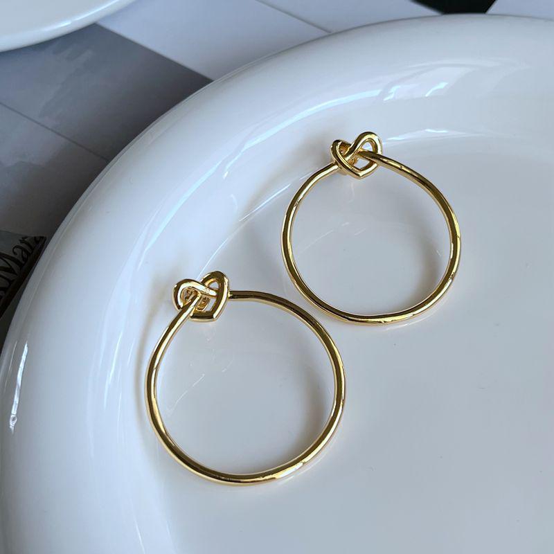 

Trendy Minimalist Knot Heart Metal Circle Stud Earrings золотой