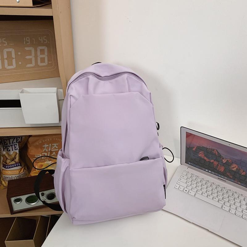 Schoolbag new large-capacity high-value junior high school student casual schoolbag Japanese and Korean version solid color fashionable simple