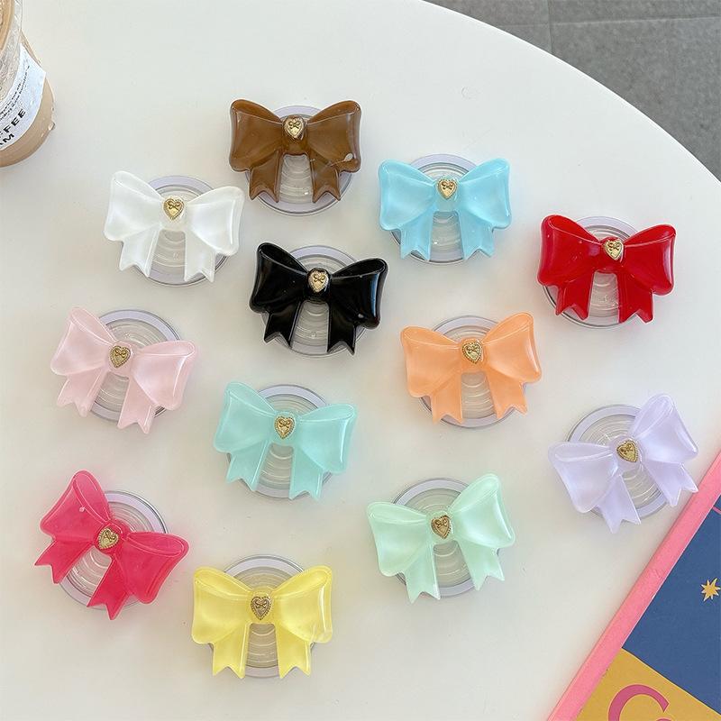 Small Love Three-Dimensional Bow Mobile Phone Airbag Bracket Magnetic Suction Telescopic Folding Desktop Bracket Wind