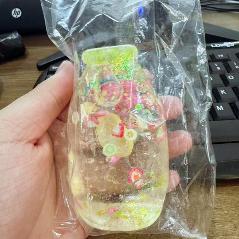 Fruit Hard Candy Glass Bottle Shaped Stress Ball Transparent Soft Squeeze Fidget Toy for Kids Adults Anxiety Relief Office Desk Use
