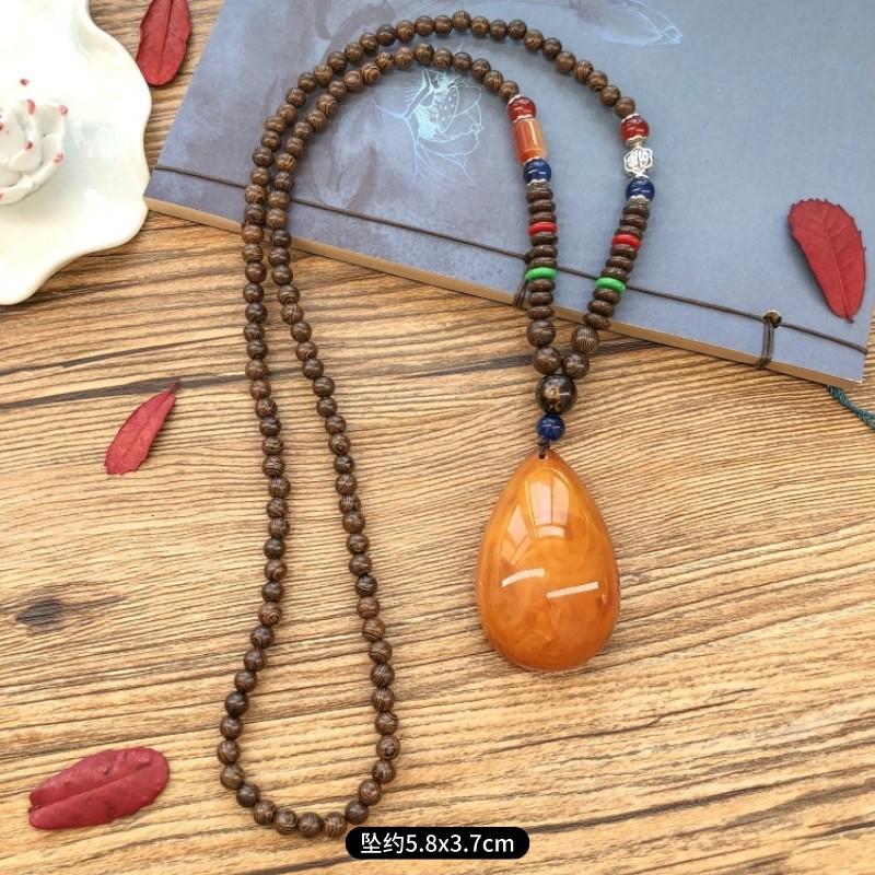 Retro chicken wing wood second generation old beeswax necklace men and women versatile amber pendant long sweater chain pendant