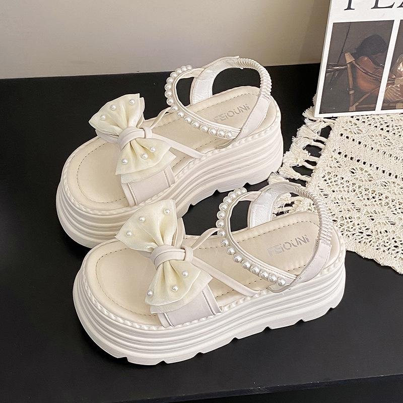 Platform bow sandals female popular summer new Korean version fairy wind pearl one-word buckle with muffin beach sandals