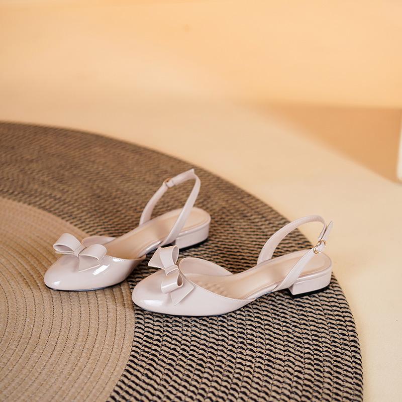 

After empty bag head sandals female 2025 new flat-bottomed fairy wind bow thick heel French sandals one-word strap single shoes 40