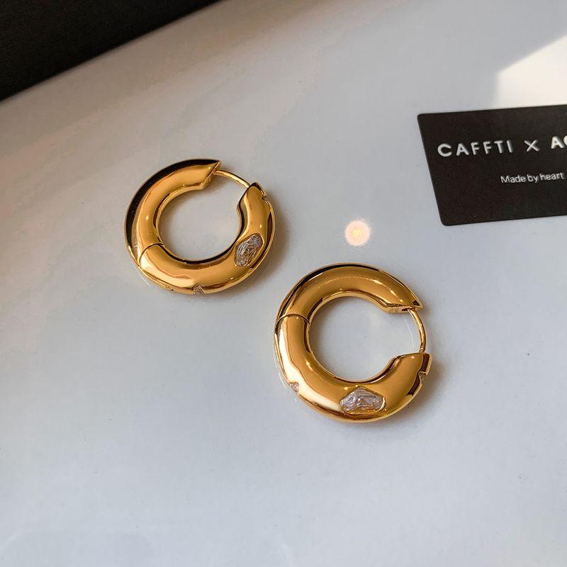 

European and American Style Gold Metal Rotating Diamond Hoop Earrings 2026 New Popular High-End and Stunning Earrings Gold