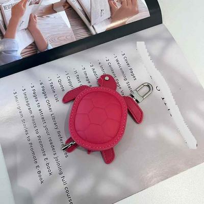2025 New Leather Pendant Head Layer Leather Mini Earphone Bag Turtle Pendant Wallet Cross Border