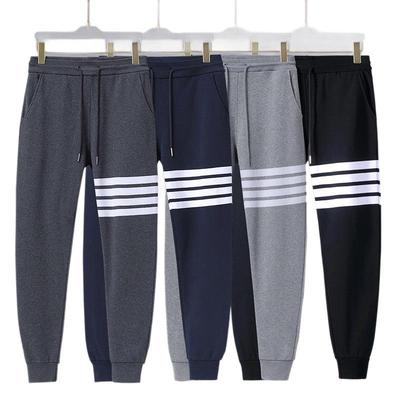 Pantaloni della tuta in cotone spugna a quattro strisce, marca di tendenza: Casual Skinny Fit Europeo e Americano