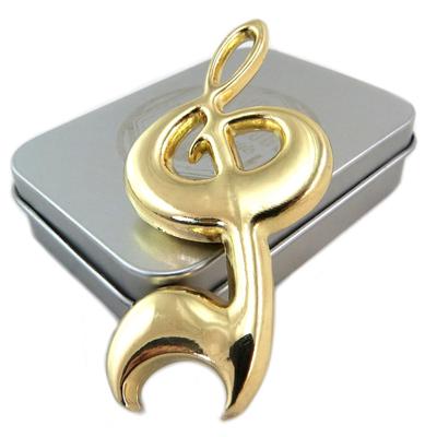 [P6525] - Abridor de garrafas 'Musicology' em ouro (clave de sol) - 75x35x8 mm