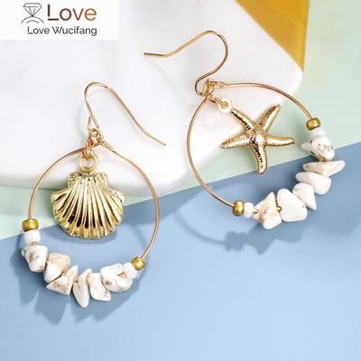 Zoshi Muschel-Ohrringe für Damen Goldfarben Trendige Metallmuschel Kauri Statement Hängeohrringe Neuer Sommer-Strandschmuck