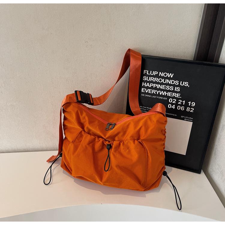 

2025 Japanese simple messenger bag women s fashion large-capacity dumpling bag solid color versatile shoulder bag student class bag оранжевый