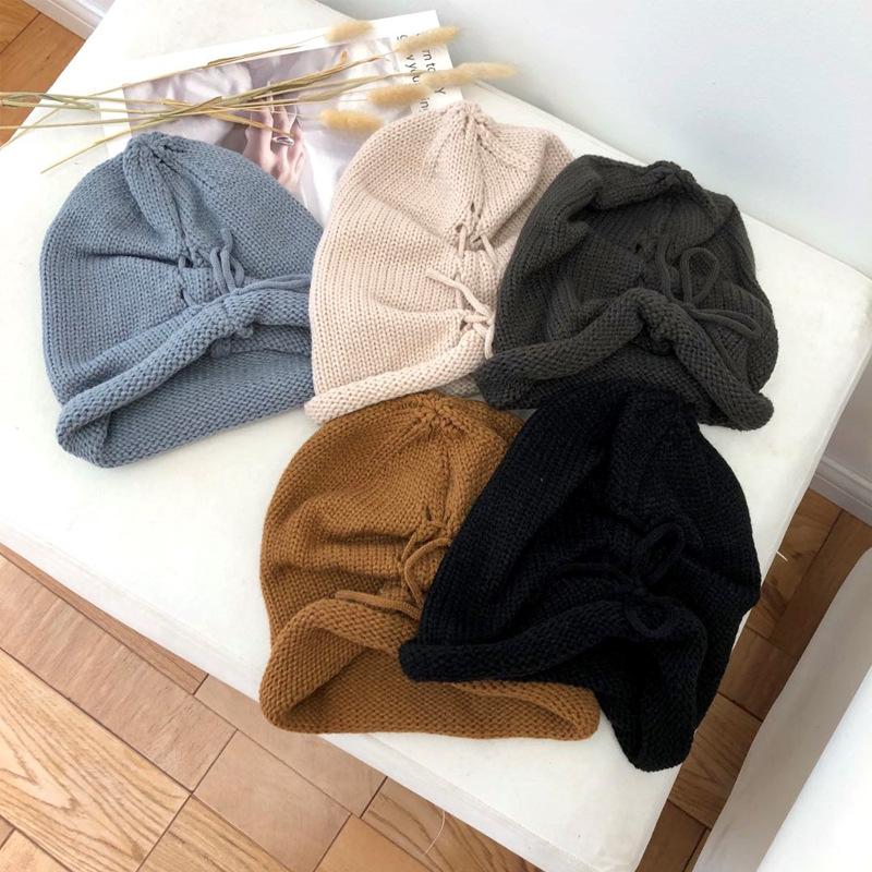 Autumn and winter solid color warm crimped wool hat men's and women's versatile knitted hat fashion street drawstring stacking hat