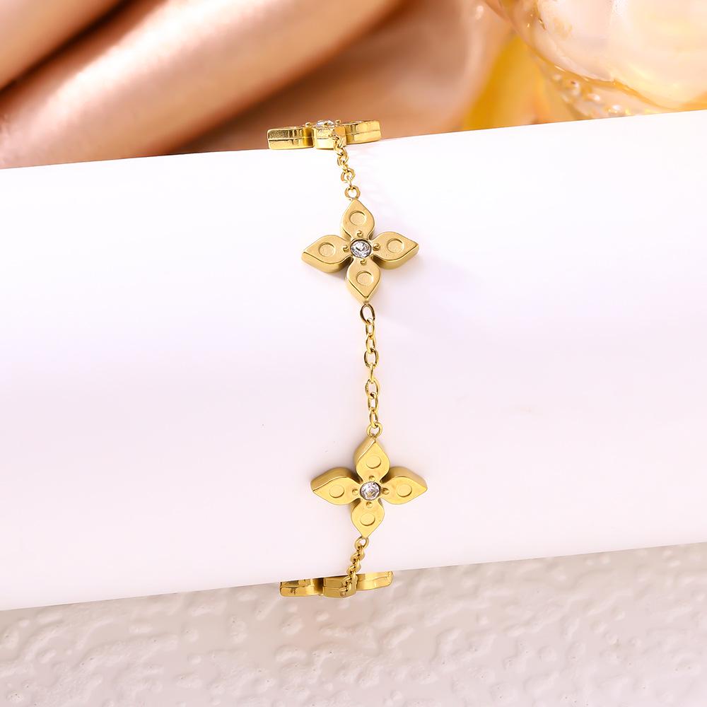 Elegant Four-Leaf Clover Titanium Bracelet with Micro-Paved Diamonds - Light Luxury Women's Floral Jewelry