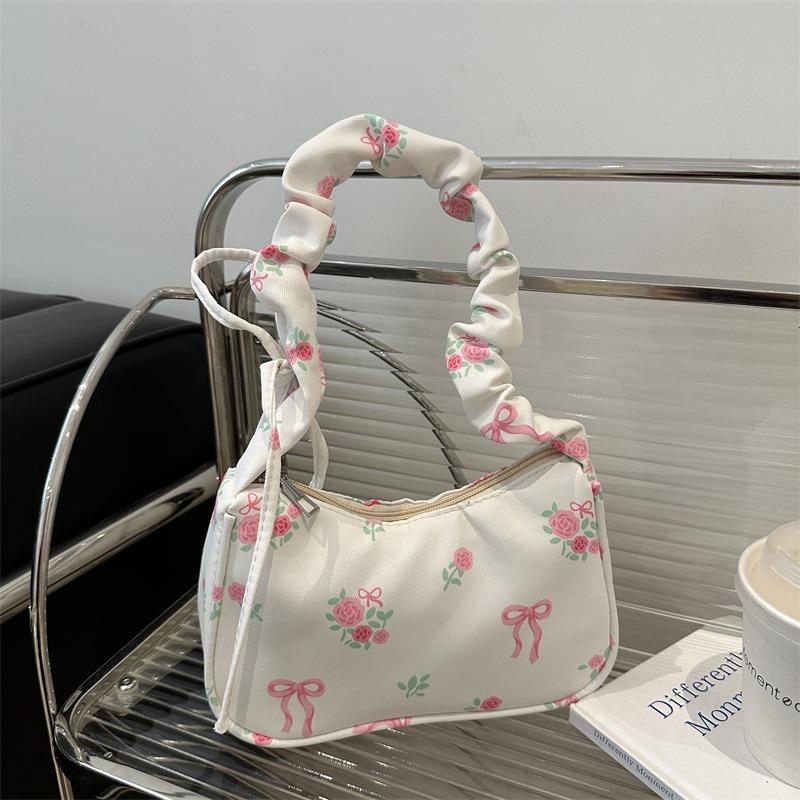 Gentle and sweet flower canvas bag women's new drawstring shoulder bag high value floral bow armpit bag