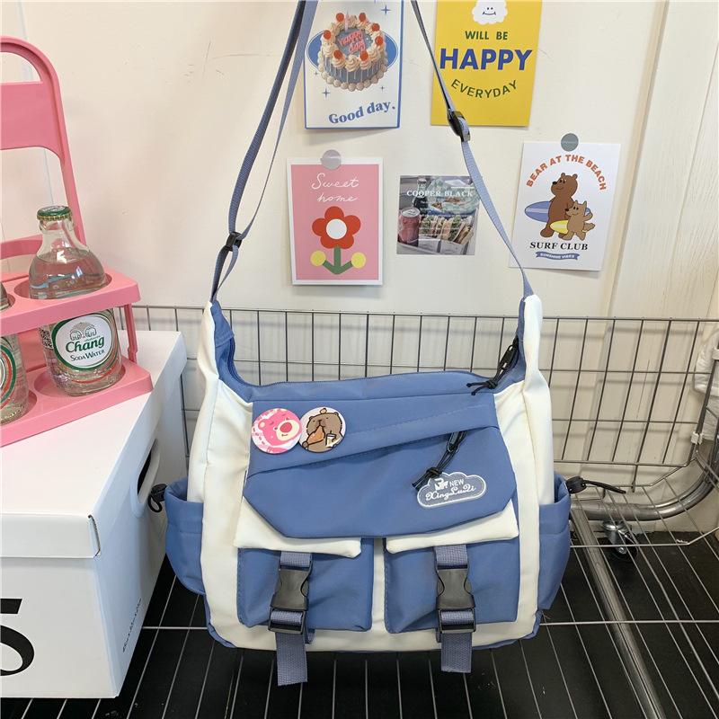 Spring and summer new messenger bag men's trendy brand large capacity ins shoulder bag Japanese casual mailman bag versatile small satchel