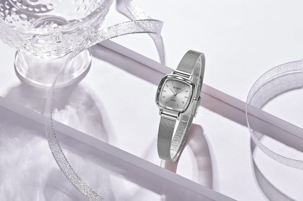 waterproof watch with a thin silver mesh strap and fashionable quartz Women's small, simple, movement.