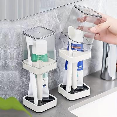 Portacepillos de dientes con vaso para cepillos de dientes normales, almacenamiento para pasta de dientes, portacepillos de dientes y pasta de dientes de tres ranuras.