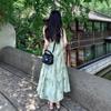 New Chinese women's sleeveless neck-hanging dress, cold and relaxed in early spring, wear a suspender green floral dress