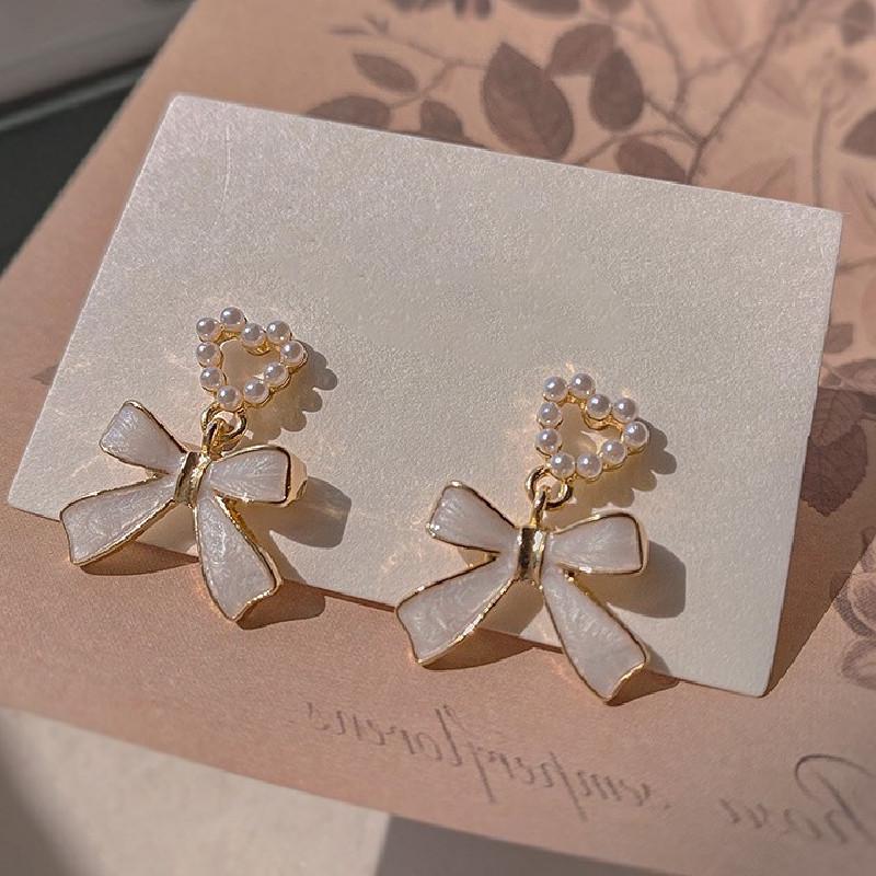 Korean Unique Pearl Bow Earrings for Women 2024 - Stylish, Versatile, and Elegant Stud Jewelry