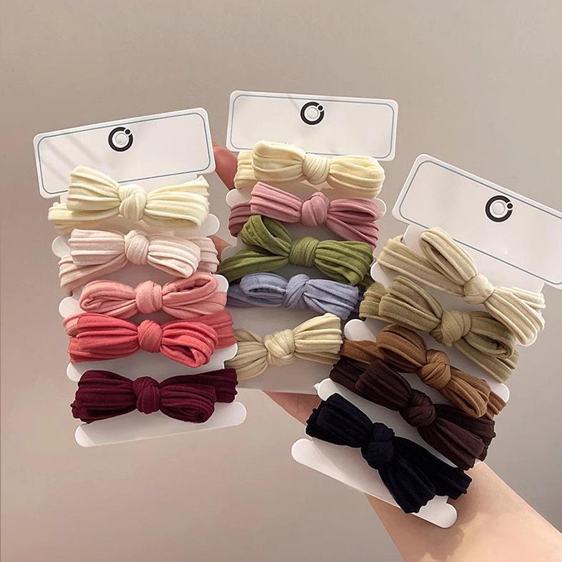 2025 New Women's Bow Hair Tie - High Elasticity & Durable Leather-Covered Rubber Band