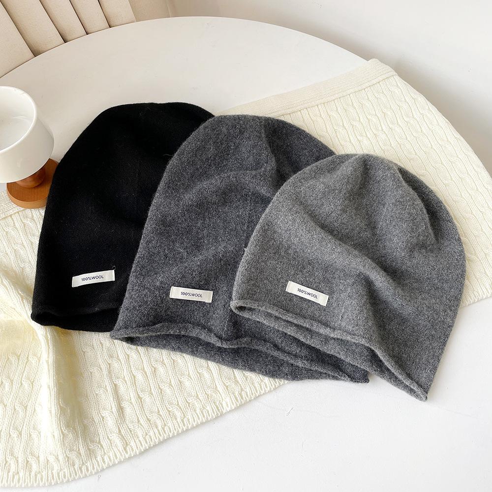 Solid color wool knitted stacking hat women's autumn and winter 0% all-wool knitted hat fashionable versatile cold hat ear protection hat
