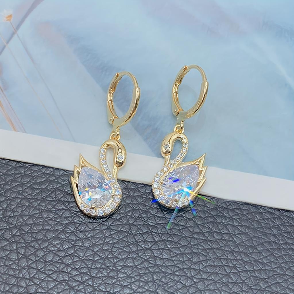 1 Pair of Luxurious Golden-Tone Swan Dangle Earrings with Sparkling Rhinestones - Elegant Zinc Alloy Fashion Jewelry for Women