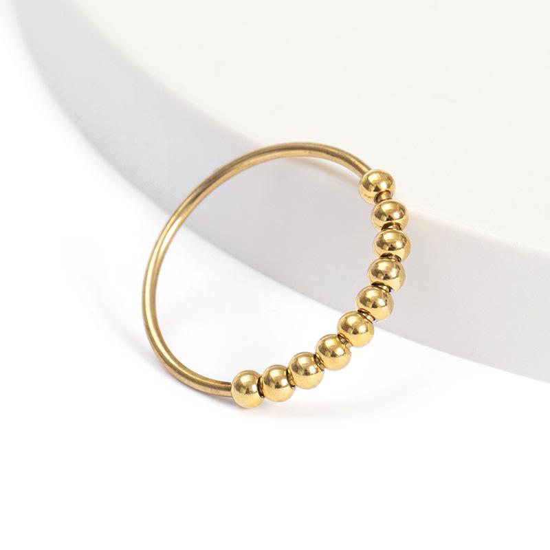 Neuer drehbarer Stressabbau-Angstring mit Perlen