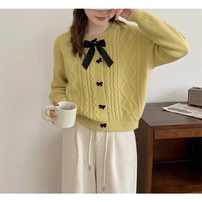 Solid color knitted cardigan women's new autumn and winter bow button with twist sweater jacket