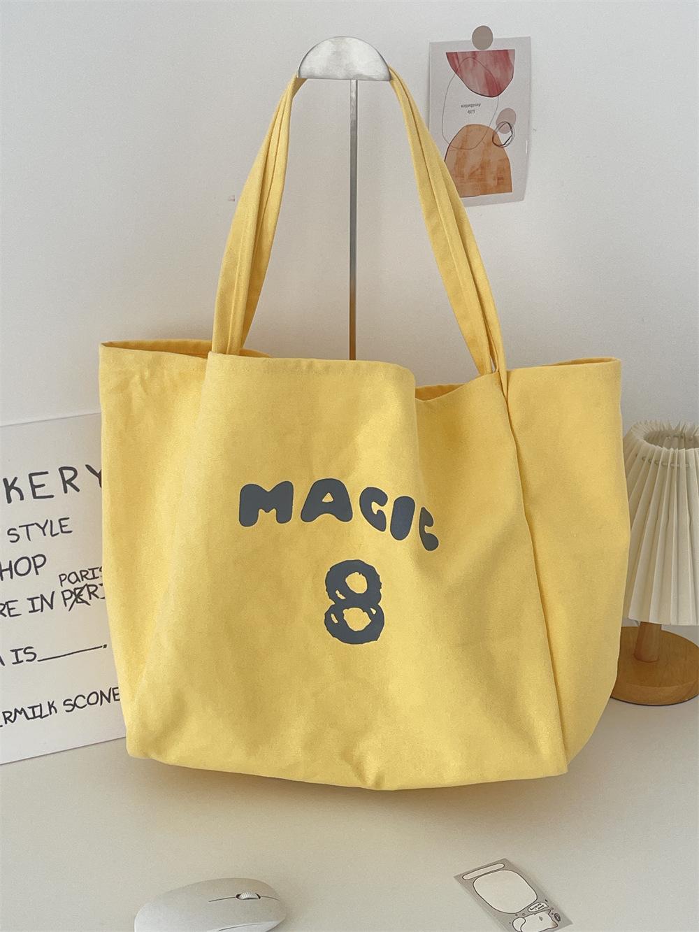 

Spring and summer letter print tote bag canvas women s bag niche design large capacity lazy commuter shoulder bag