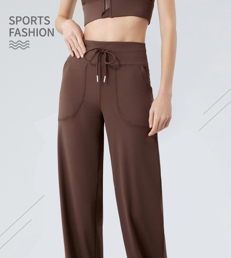 Dámské široké kalhoty se stahovací šňůrkou na jógu a fitness - Volné, ležérní a zeštíhlující design s rovnými nohavicemi